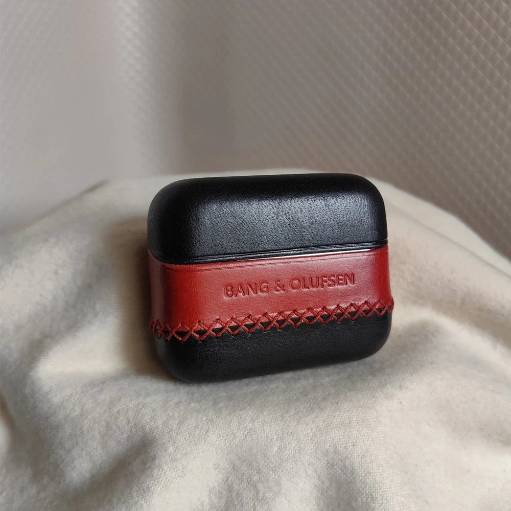 Front view of the Ronuo handmade Black and Red leather case for Bang & Olufsen Beo Grace, featuring a bold red central band with embossed B&O logo and contrasting black hand-stitched detailing.