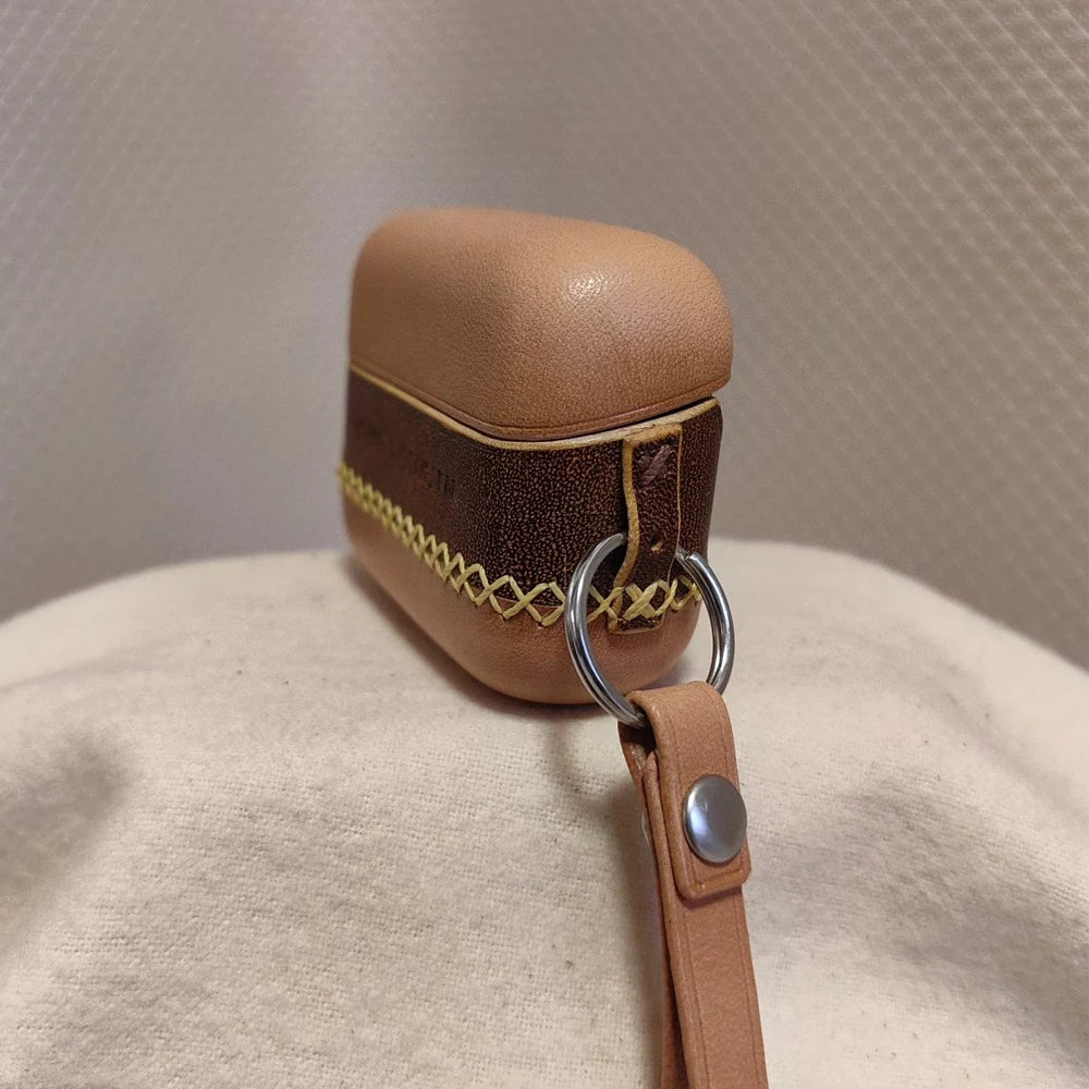 Side view of the Ronuo handmade leather case for Bang & Olufsen Beo Grace, highlighting the precision indicator light cutout and the secure metal ring attachment with a portable leather strap.