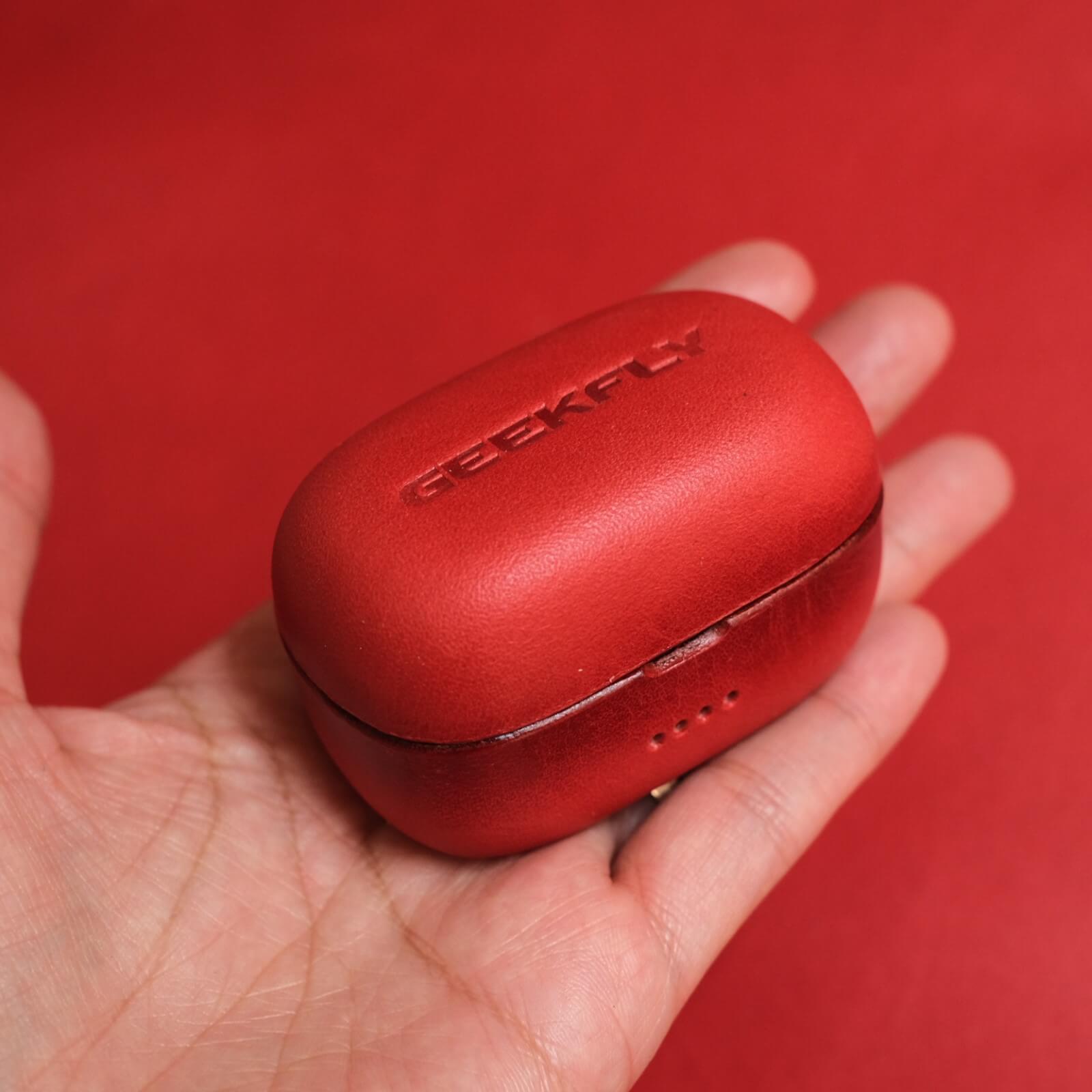 Handcrafted personalized genuine leather earbuds red case for Geekfly Vitas in hand