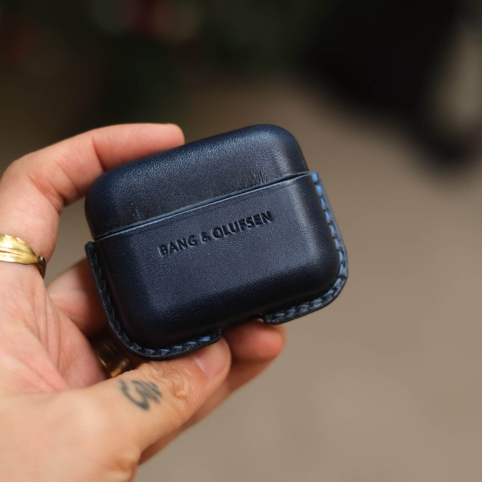 Handcrafted custom personalized orange and elephant gray leather earbuds case for Bang &amp; Olufsen Beo Grace with side keychain and orange leather strap