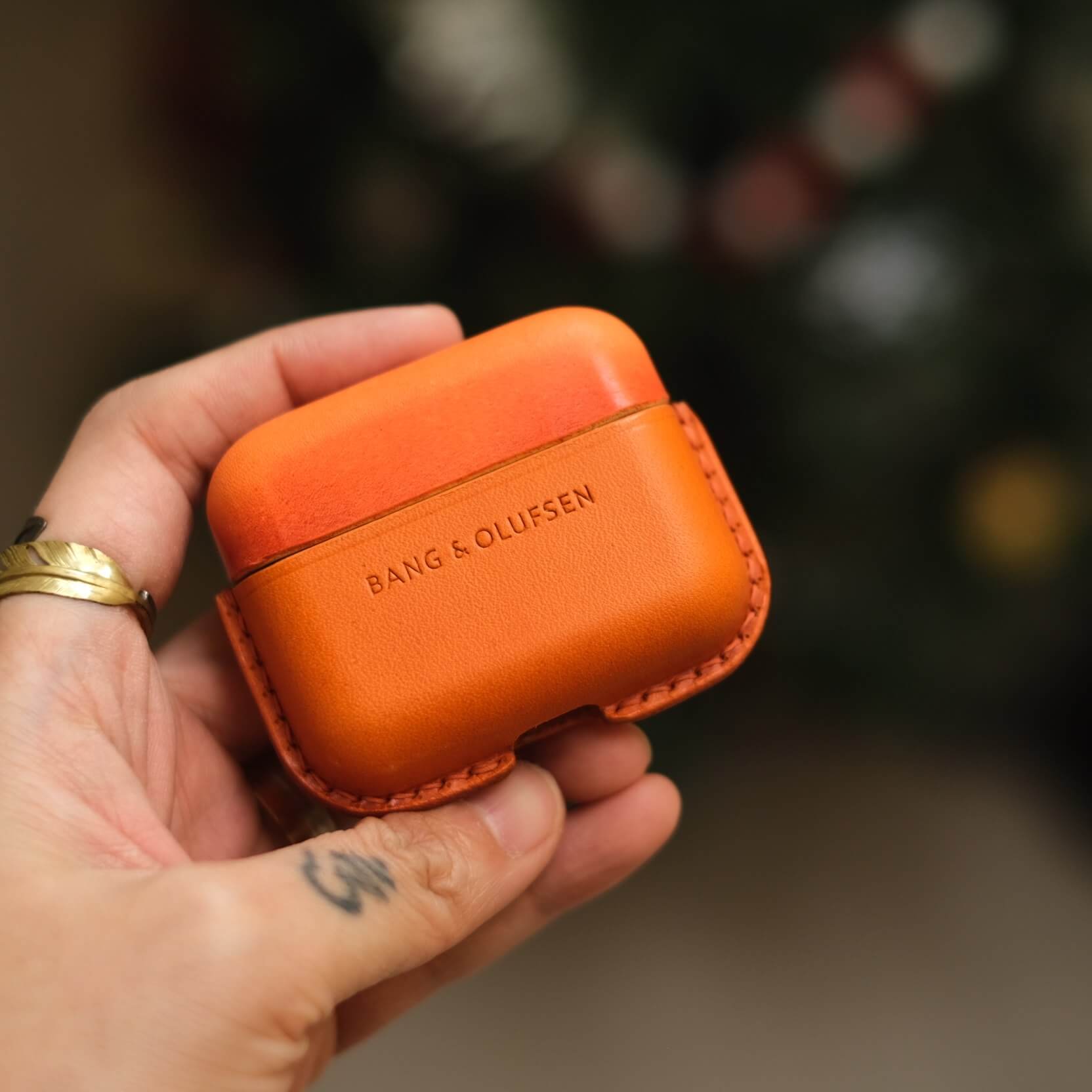 Handcrafted custom personalized orange and elephant gray leather earbuds case for Bang &amp; Olufsen Beo Grace with side keychain and orange leather strap