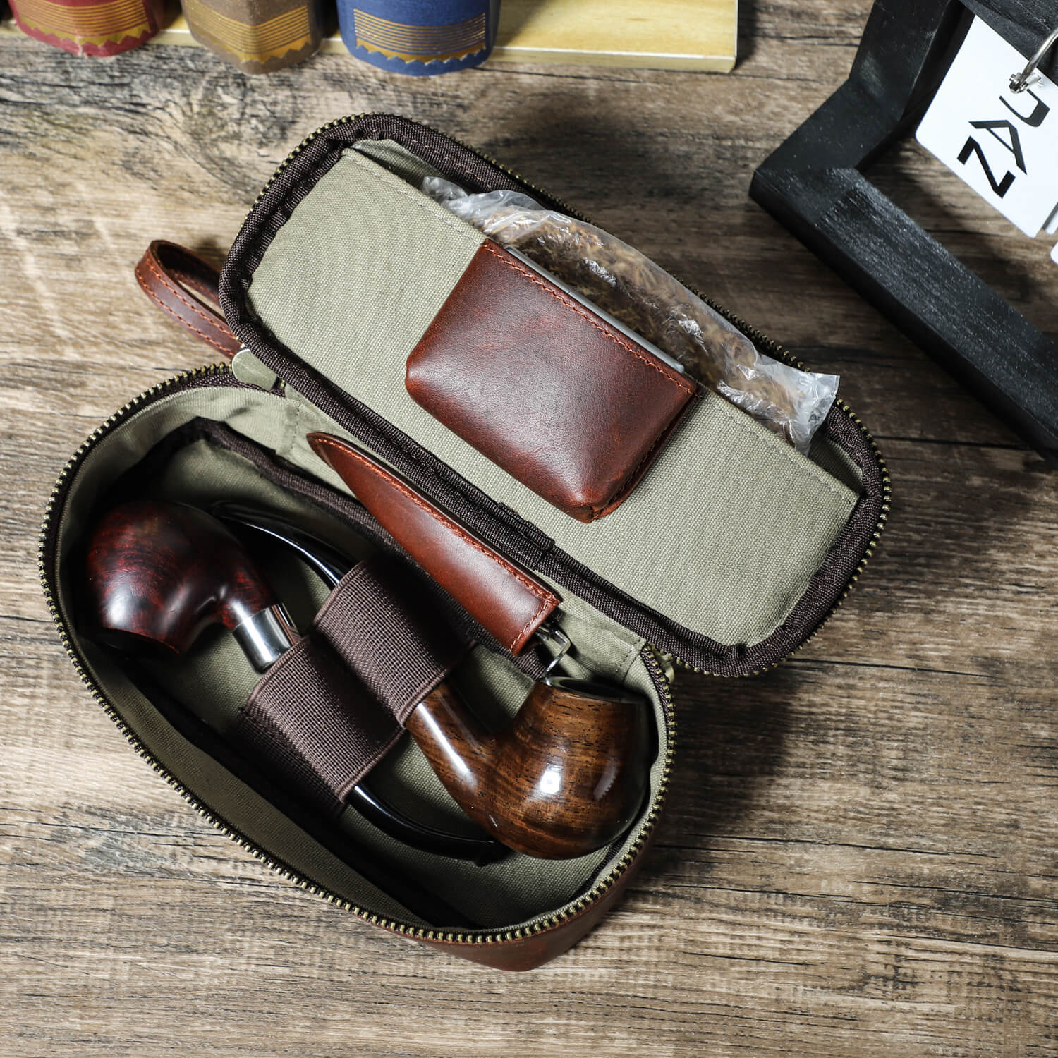Handcrafted leather pipe and tobacco pouch vintage travel case smoking accessories - close-up of opening with inside compartments
