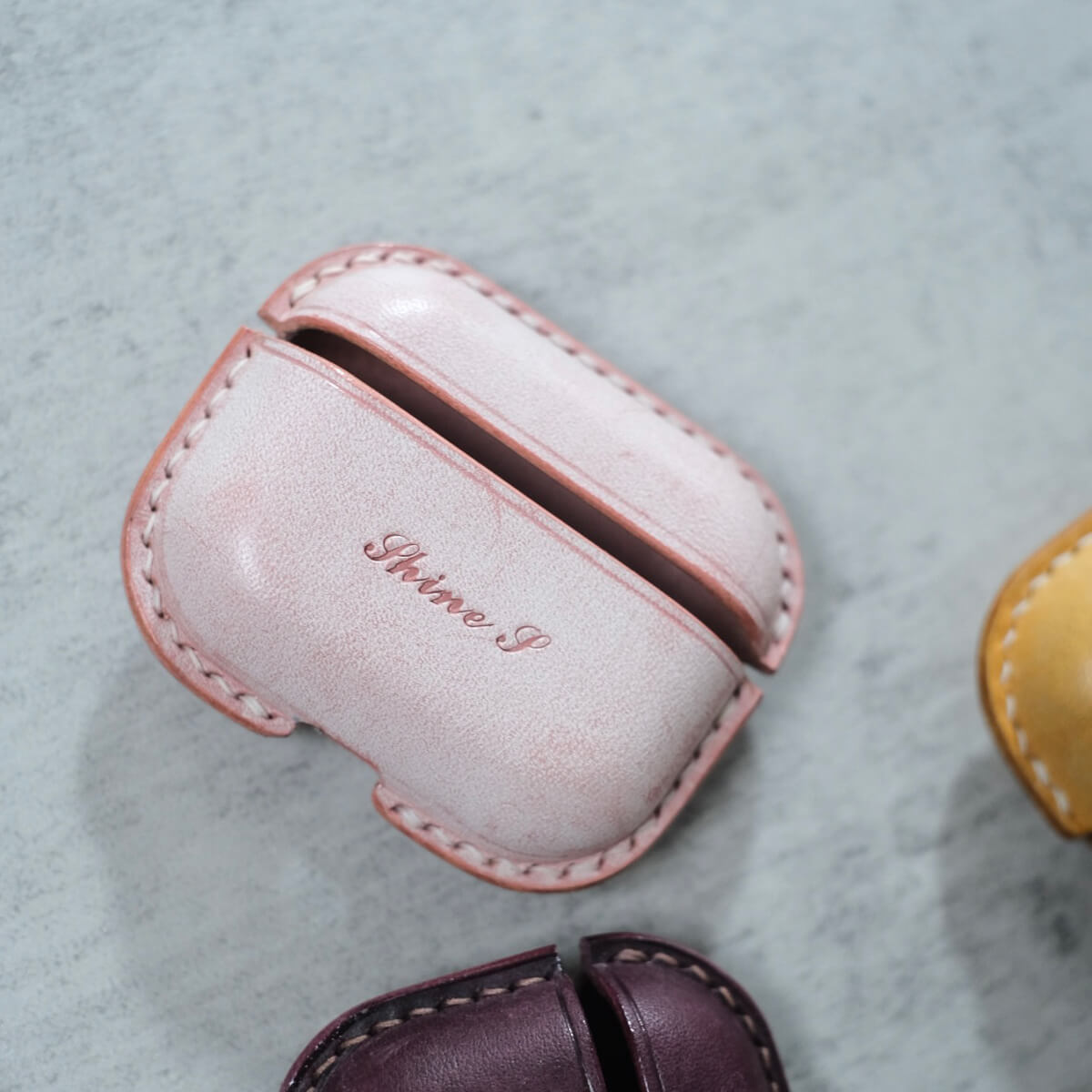 Misty wax pink handcrafted personalized leather earbuds case for AirPods Pro 3 with custom engraving text "Shine" example
