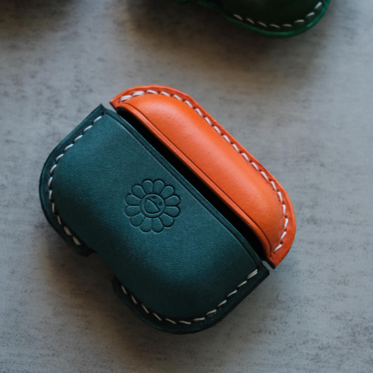 Two tones - orange and peacock blue handcrafted personalized leather earbuds case for AirPods Pro 3 with personalized custom smile sunflower pattern