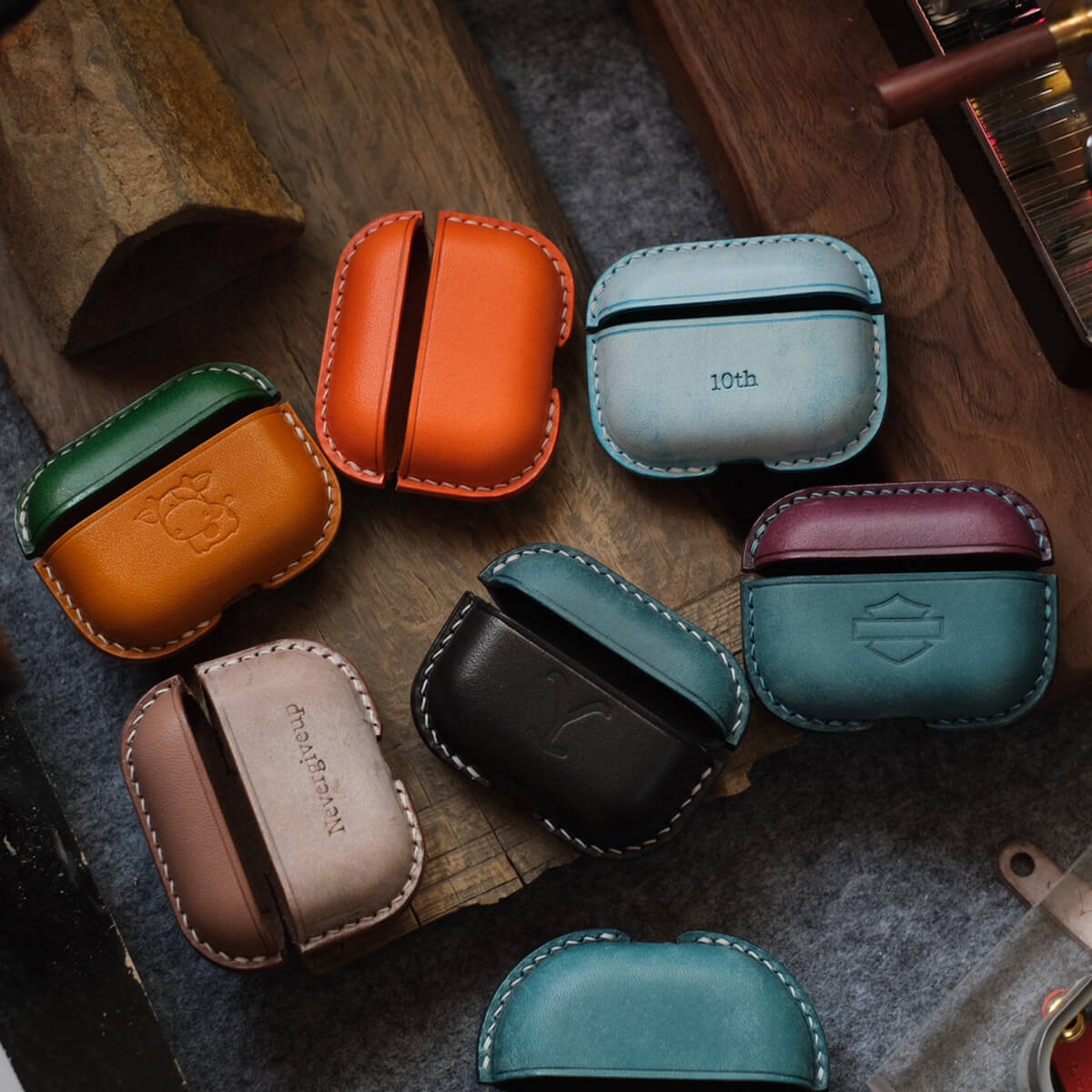 Collection of handcrafted personalized leather earbuds case for AirPods Pro 3 cases in various colors and customized text and pattern design