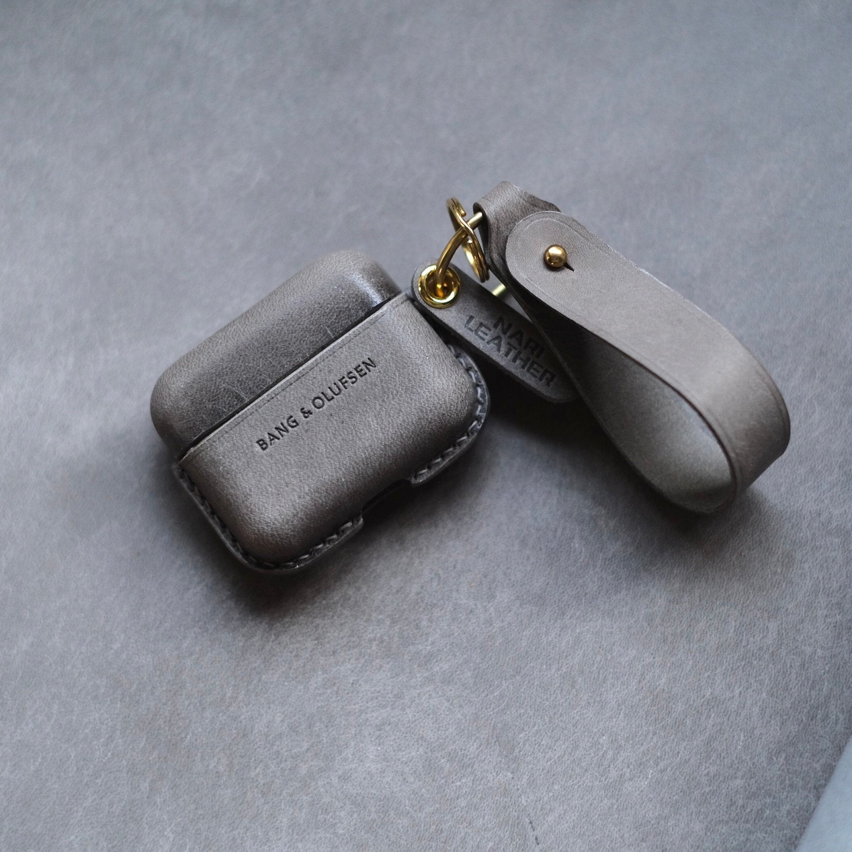 Handcrafted custom personalized elephant gray leather earbuds case for Bang &amp; Olufsen Beo Grace with side keychain and leather strap