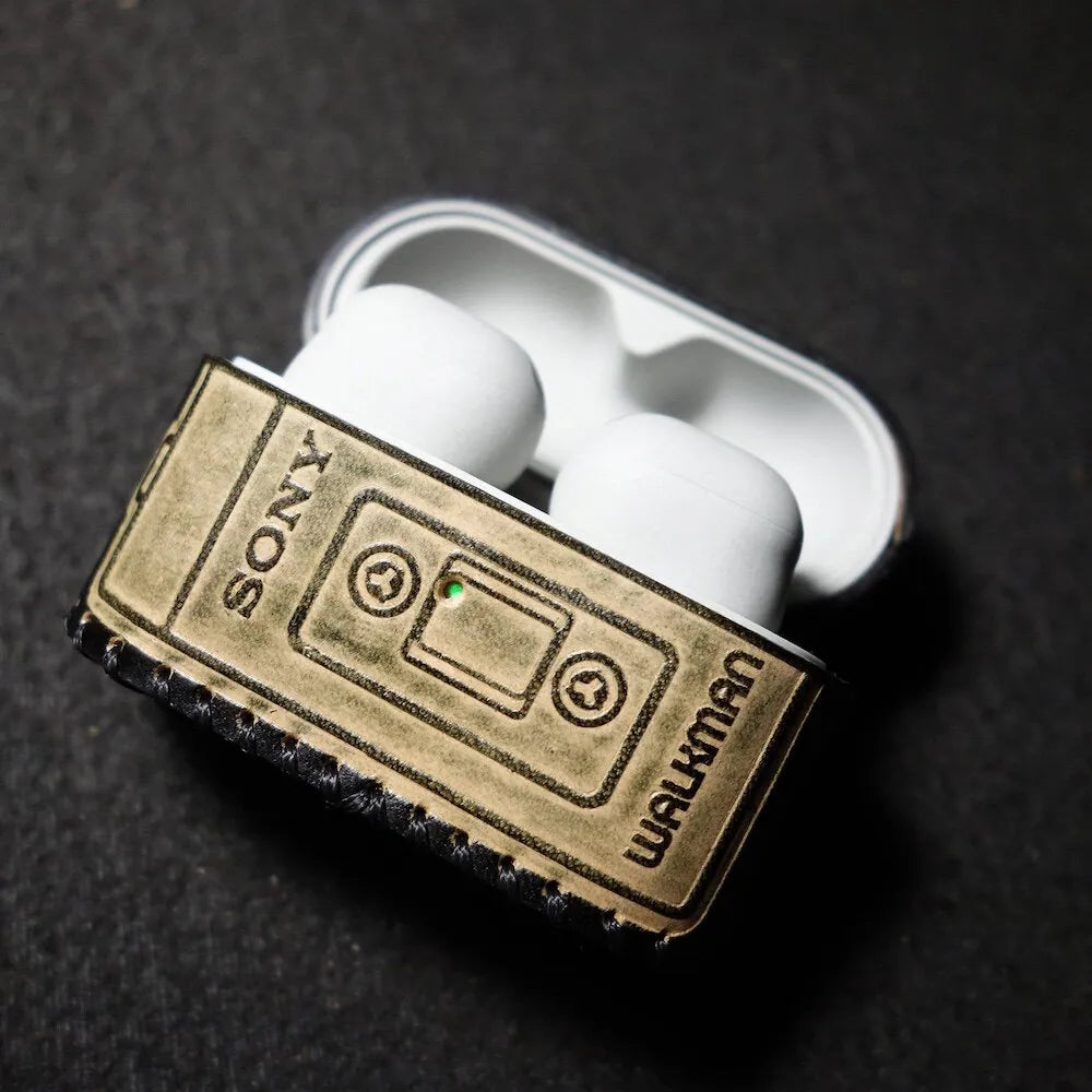 Close-up of the premium embossed leather on the Sony WF-1000XM6 case, showcasing the exquisite craftsmanship and vintage Walkman feel.