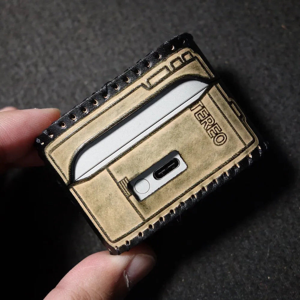 Walkman-style back view of the Sony WF-1000XM6 leather case, showing the durable construction and smooth hinge integration.