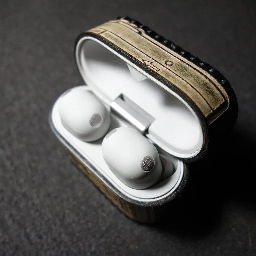 Perspective view of the opened Sony WF-1000XM6 leather case, showing the perfect fit and stylish Walkman-inspired aesthetic.