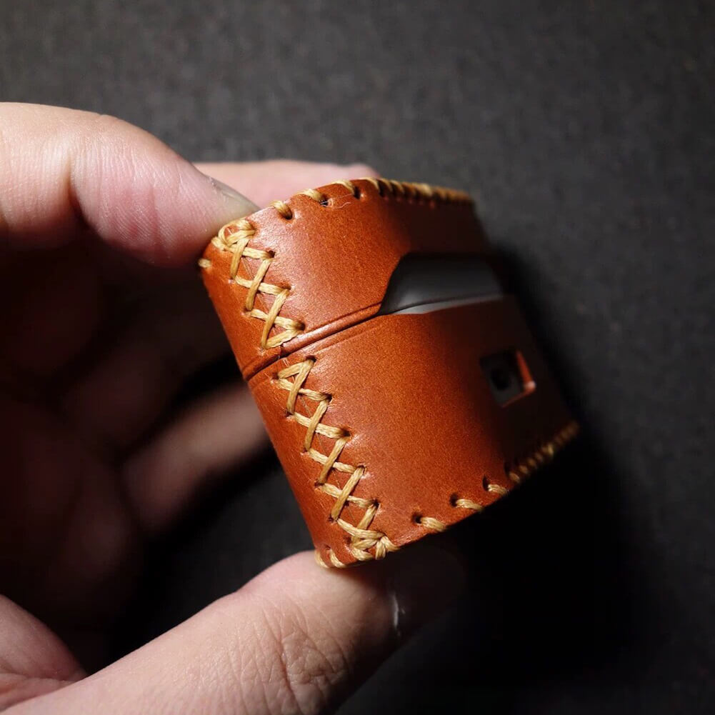 Side view of Sony WF-1000XM6 leather case highlighting the exquisite hand-stitched details and durable full-grain leather texture.