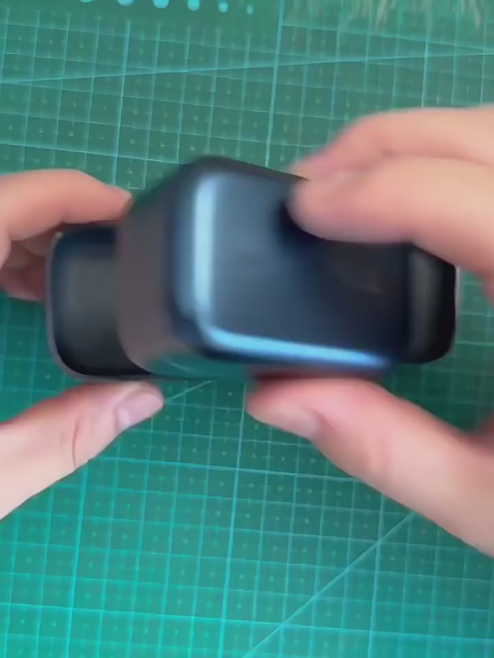 Hands demonstrating the snug fit and smooth opening of a handcrafted genuine leather protective case for Noble Osprey earbuds.