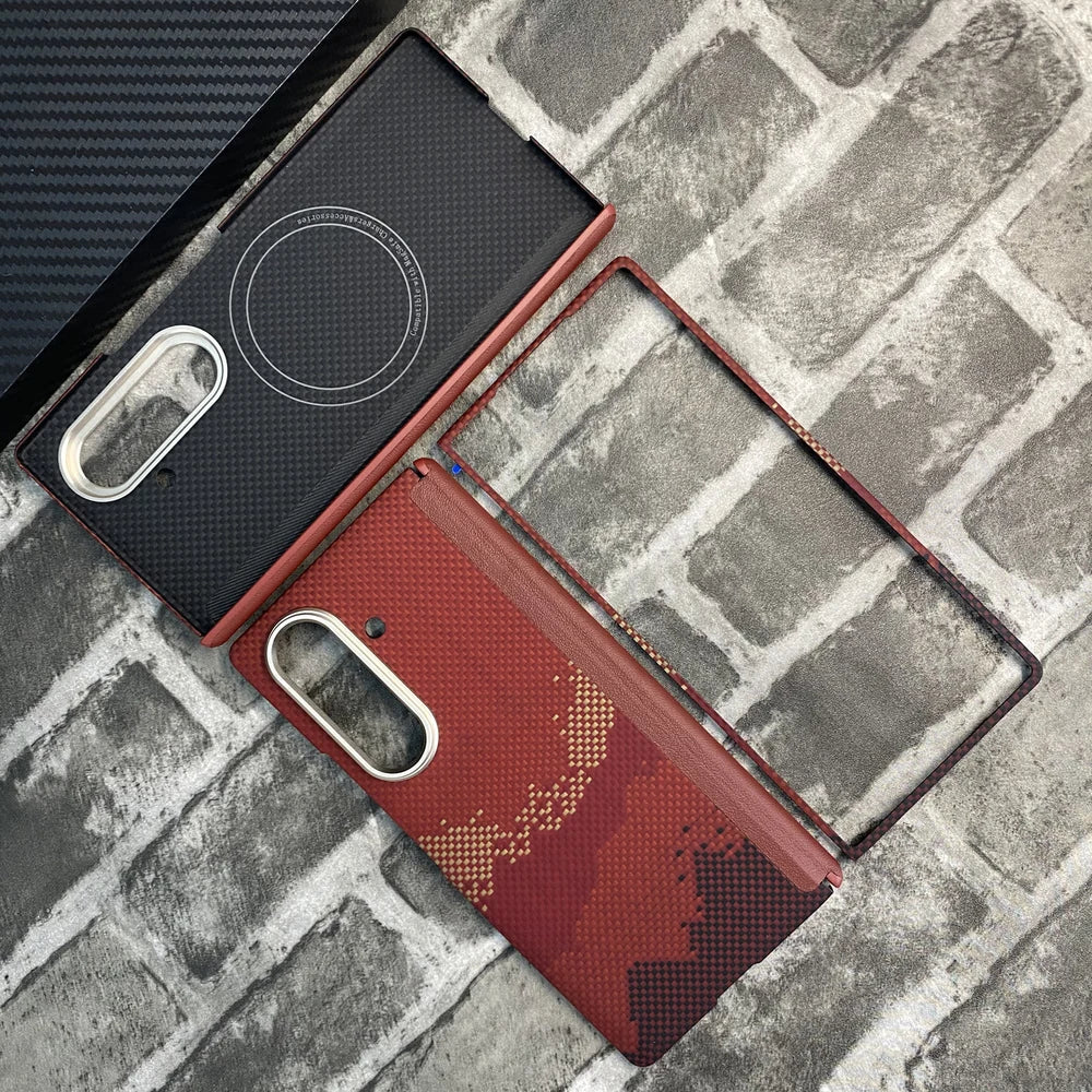 Sunlit Golden Mountain aramid fiber magnetic protective case for Samsung Galaxy Z Fold 8 Ultra. The image shows the full set with hinge protection, including the back cover built with a MagSafe-compatible magnetic ring, an attached hinge protector, and the front frame, featuring a red and golden mountain patterned woven Kevlar texture on a brick background.